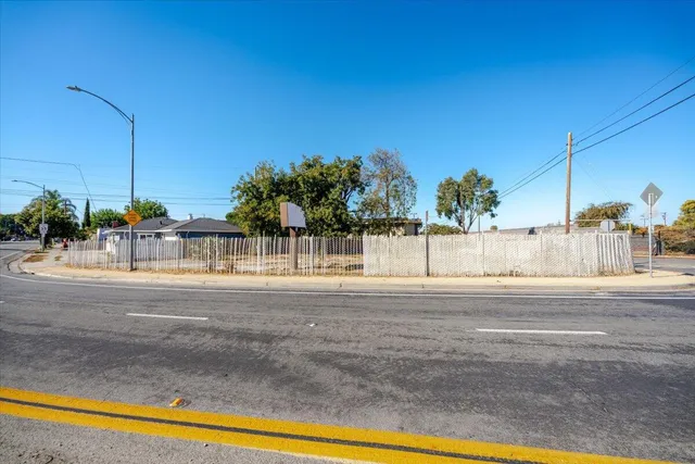 a view of a swimming pool and a cars park