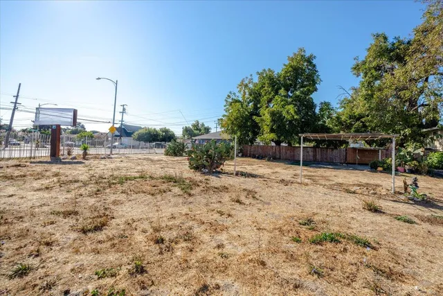 a backyard of a house with lots of green space
