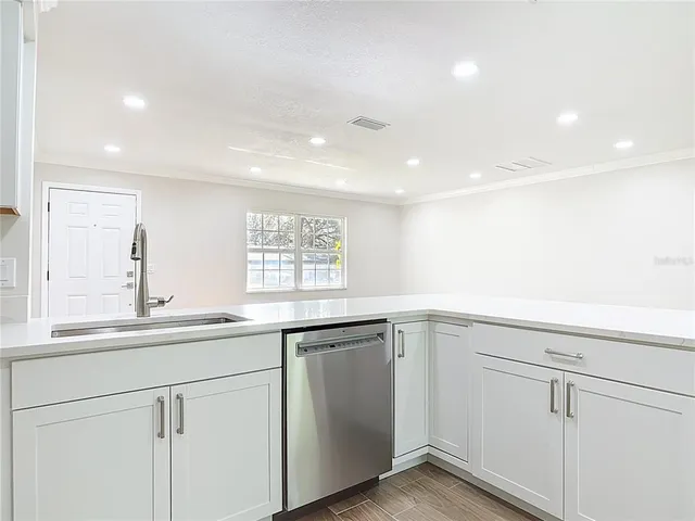 a view of a swimming pool with an outdoor space and seating area