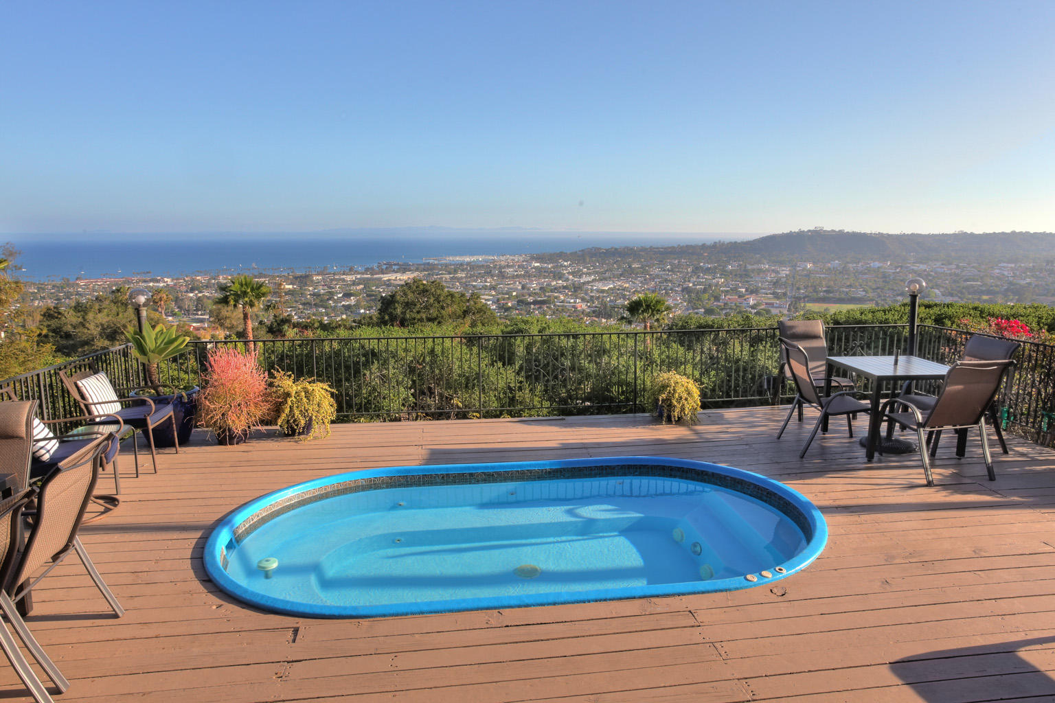 393 Las Alturas Road Santa Barbara, CA 93103 - Photo 11 of 17 a view of a swimming pool with lawn chairs