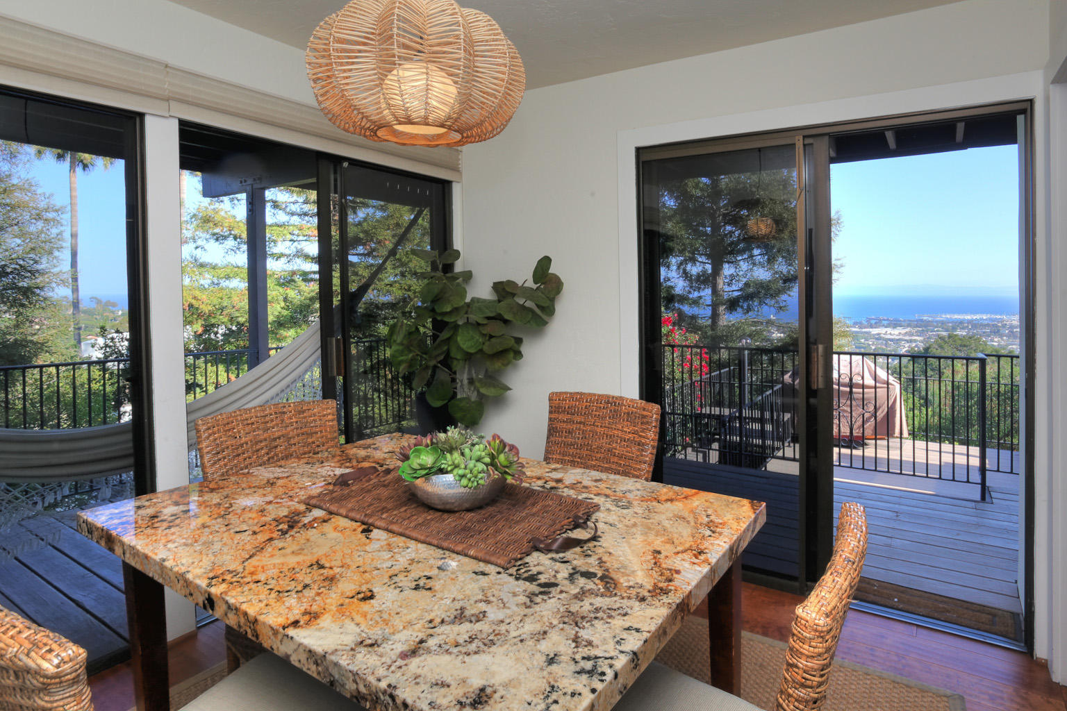 393 Las Alturas Road Santa Barbara, CA 93103 - Photo 12 of 17 a view of a dining room with furniture window and wooden floor
