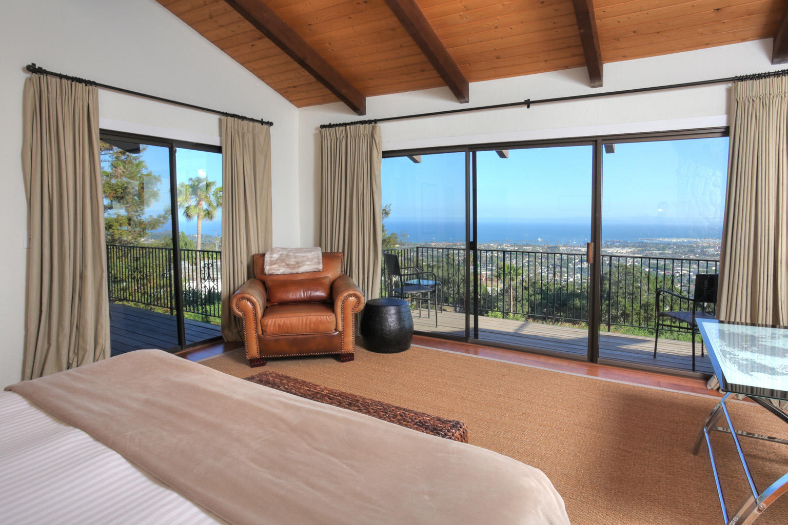393 Las Alturas Road Santa Barbara, CA 93103 - Photo 4 of 17 a bedroom with furniture and large windows