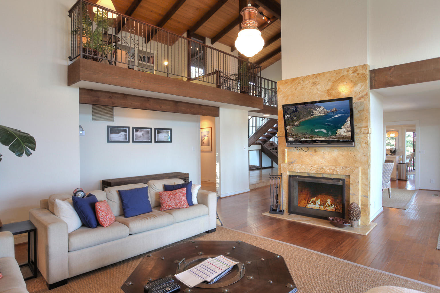 393 Las Alturas Road Santa Barbara, CA 93103 - Photo 8 of 17 a living room with furniture and a fireplace