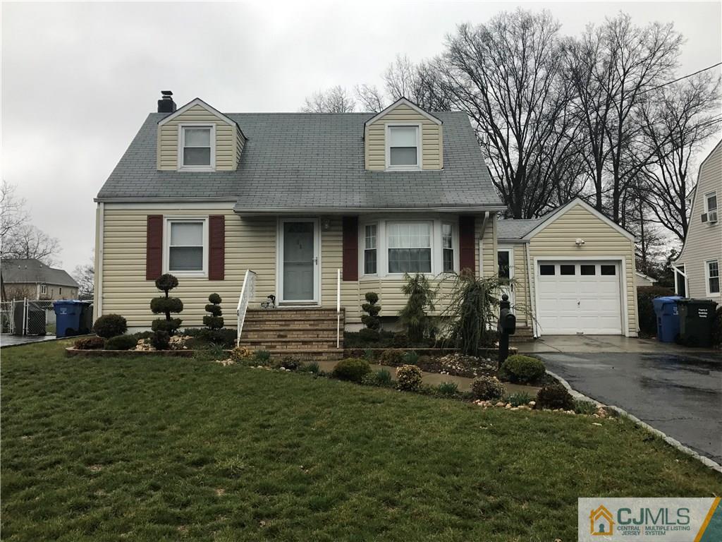 28 West Hill Road Colonia, NJ 07067 - Photo 1 of 1 a front view of a house with a yard