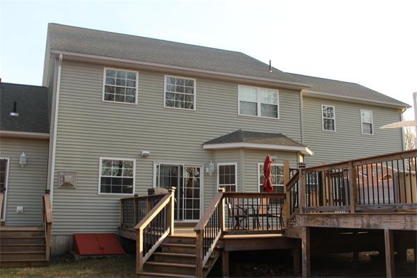 8 Button Road Easthampton, MA 01027 - Photo 3 of 10 a front view of a house with balcony