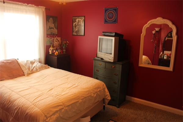 8 Button Road Easthampton, MA 01027 - Photo 9 of 10 a bedroom with a bed and a closet with wall painting