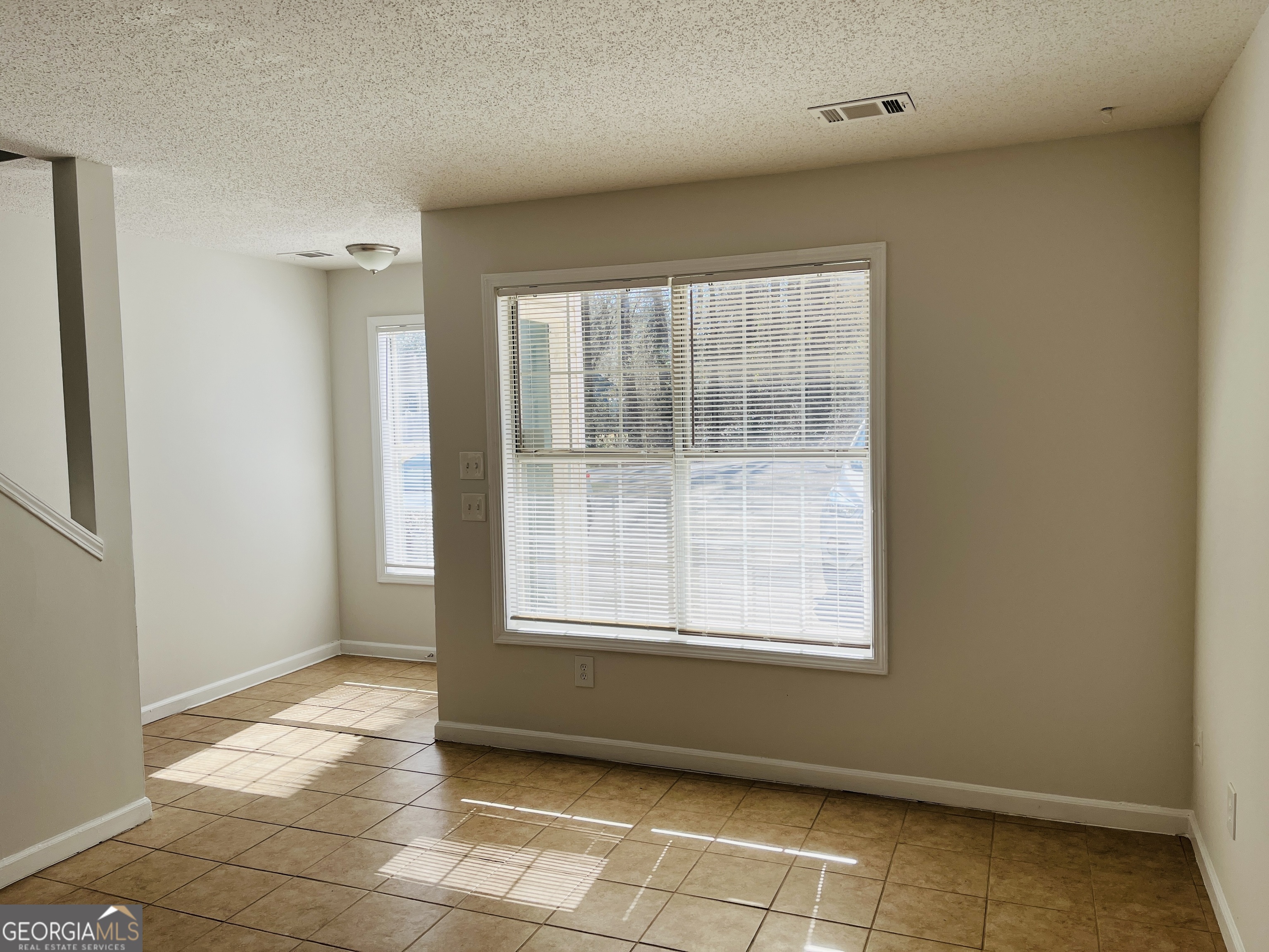 1701 Hunting Creek Lane Southeast, Unit 1701 Conyers, GA 30013 - Photo 4 of 20 an empty room with a window