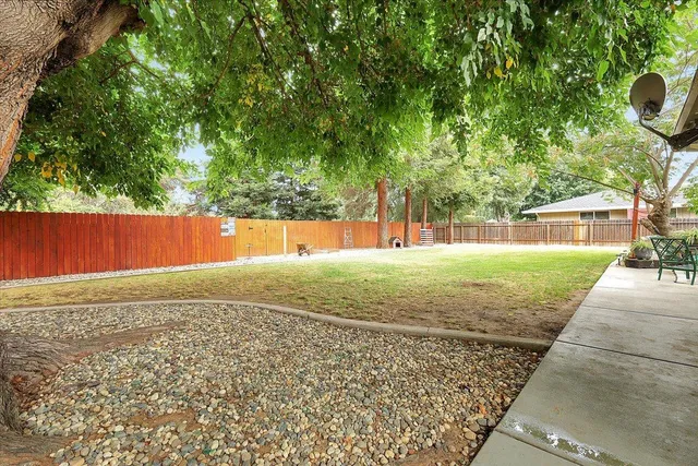 a view of a outdoor space with a patio and backyard