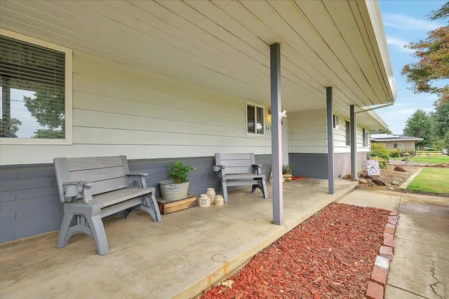 a view of a two chairs in the patio
