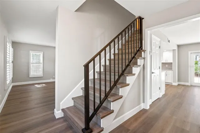 a view of entryway with wooden floor and stairs