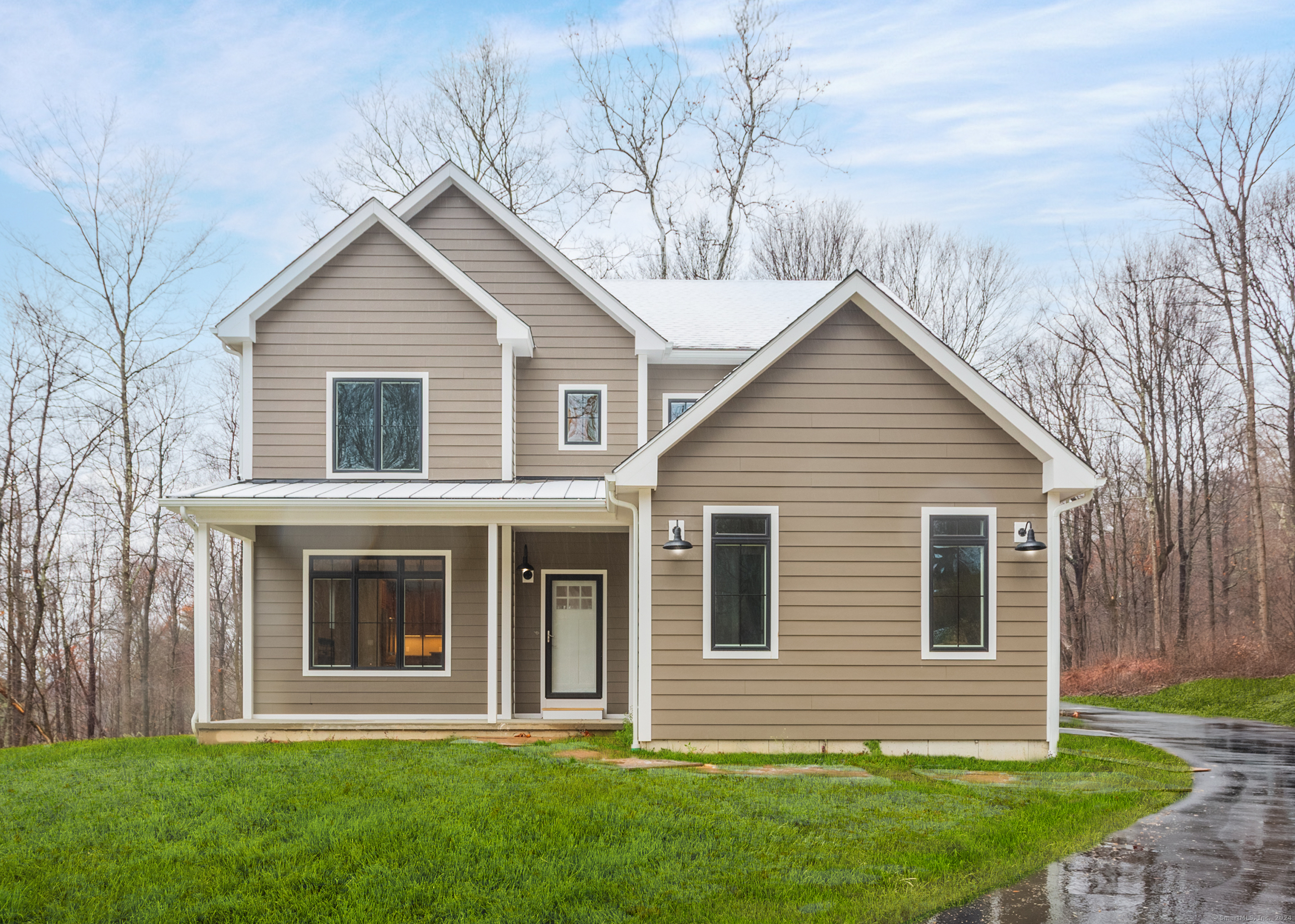 a front view of a house with a yard