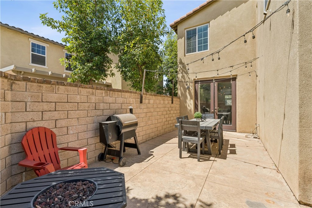 4155 Windspring Street Corona, CA 92883 - Photo 32 of 38 a view of a patio with couple of chairs