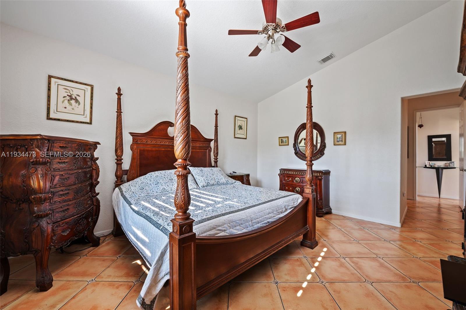 18900 Southwest 29th Street Miramar, FL 33029 - Photo 16 of 40 a bed room with a bed and a chandelier