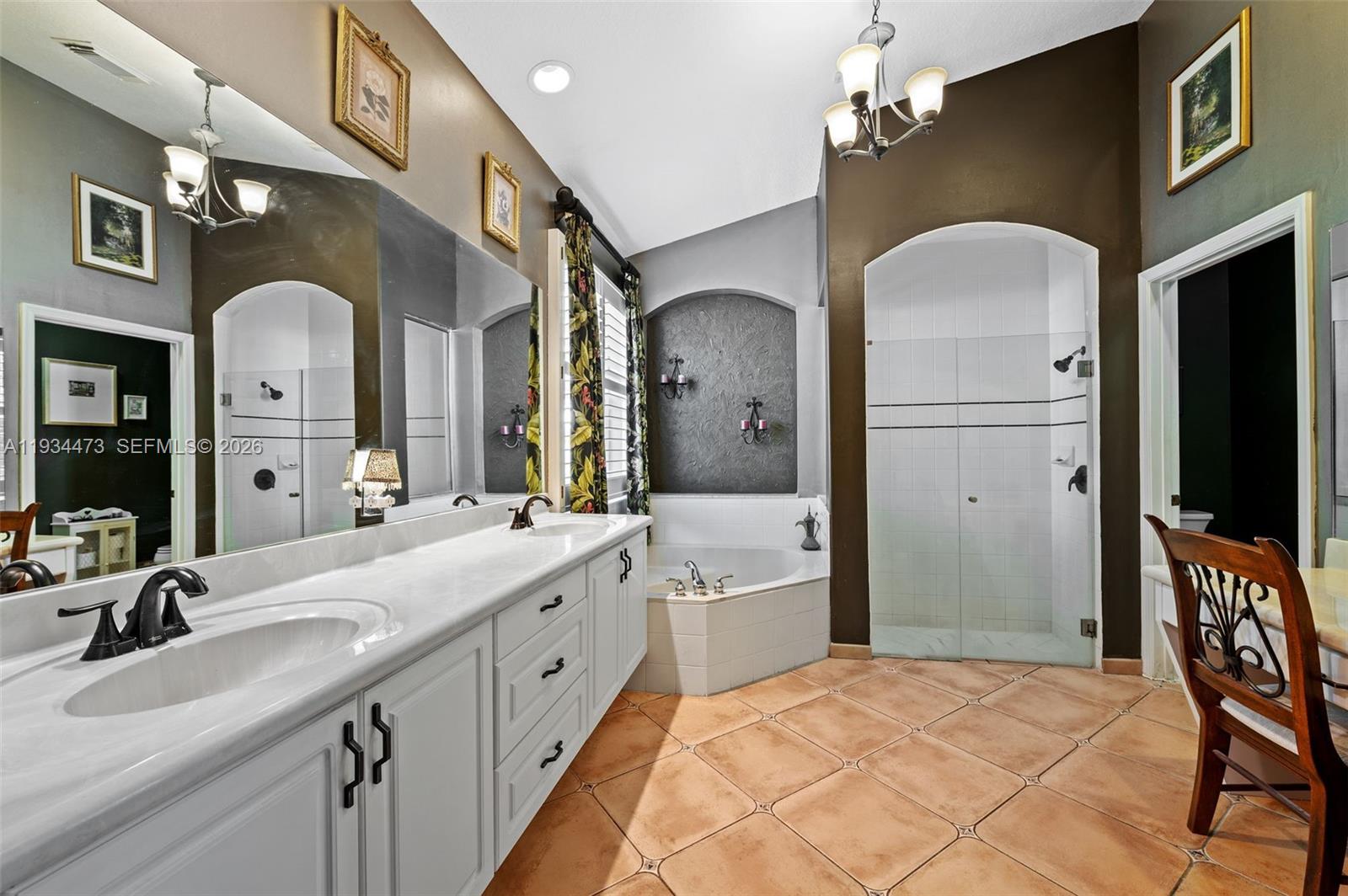 18900 Southwest 29th Street Miramar, FL 33029 - Photo 17 of 40 a spacious bathroom with a granite countertop sink a mirror and shower