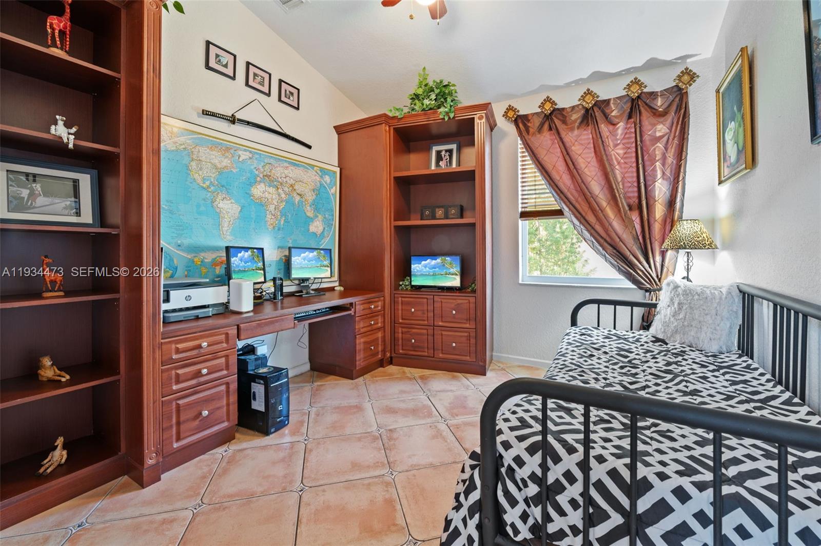 18900 Southwest 29th Street Miramar, FL 33029 - Photo 22 of 40 a bedroom with furniture and a baby crib