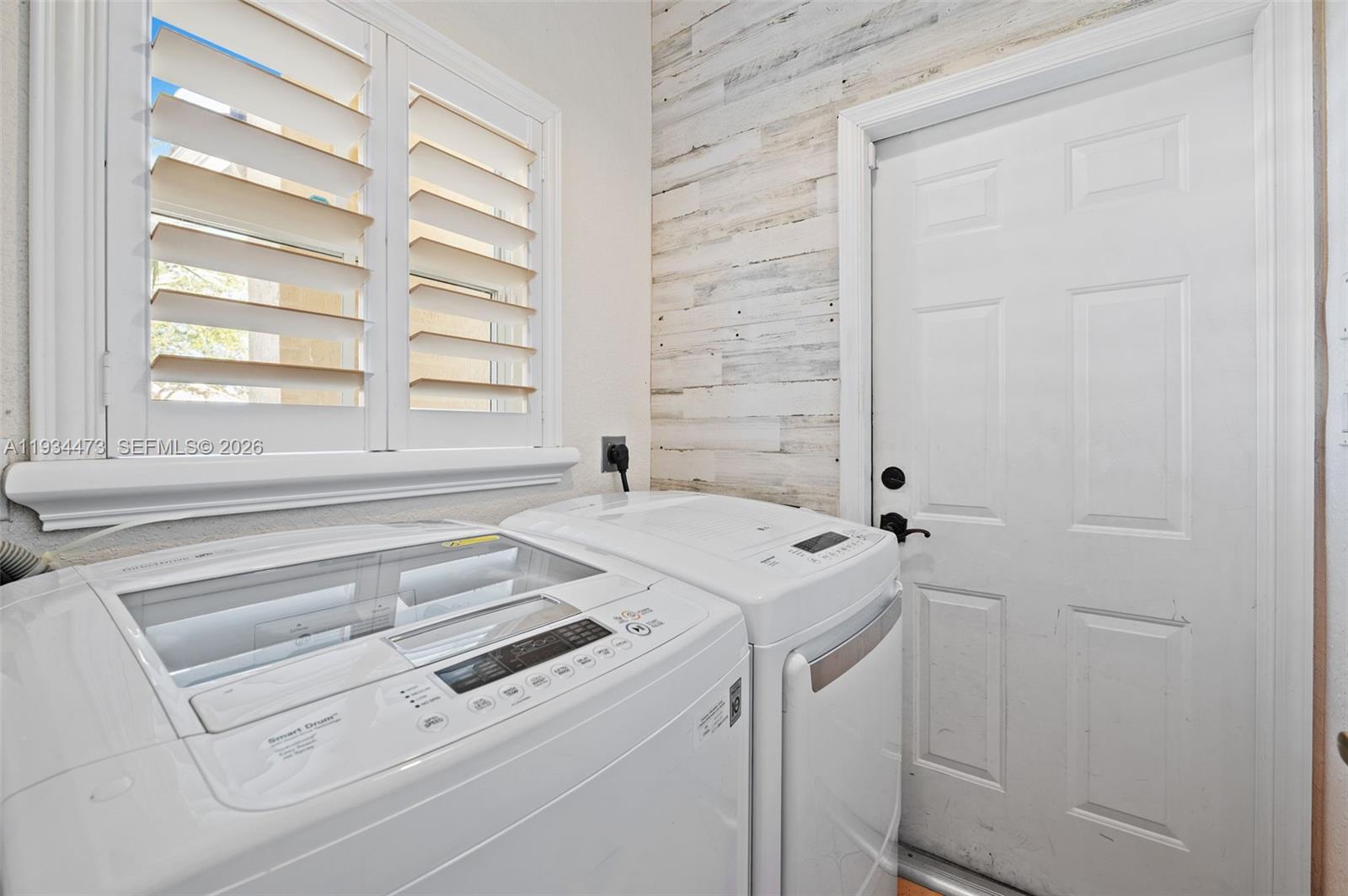 18900 Southwest 29th Street Miramar, FL 33029 - Photo 23 of 40 a utility room with dryer and washer