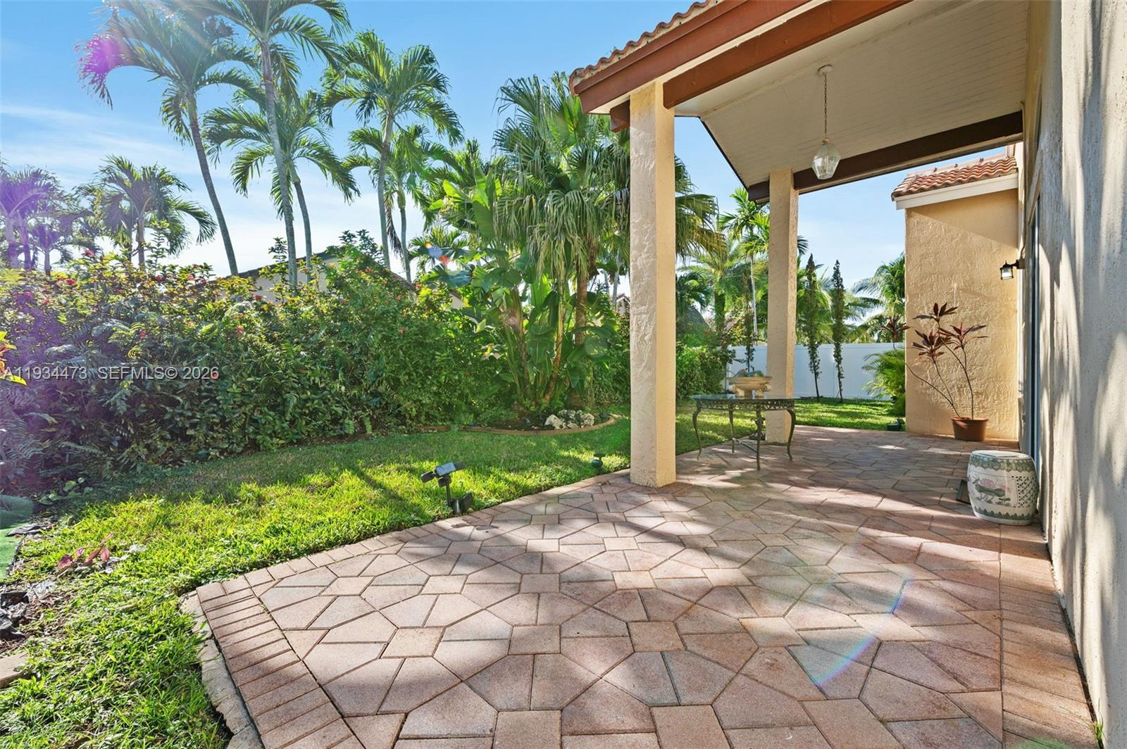 18900 Southwest 29th Street Miramar, FL 33029 - Photo 25 of 40 a view of backyard with potted plants and a palm tree