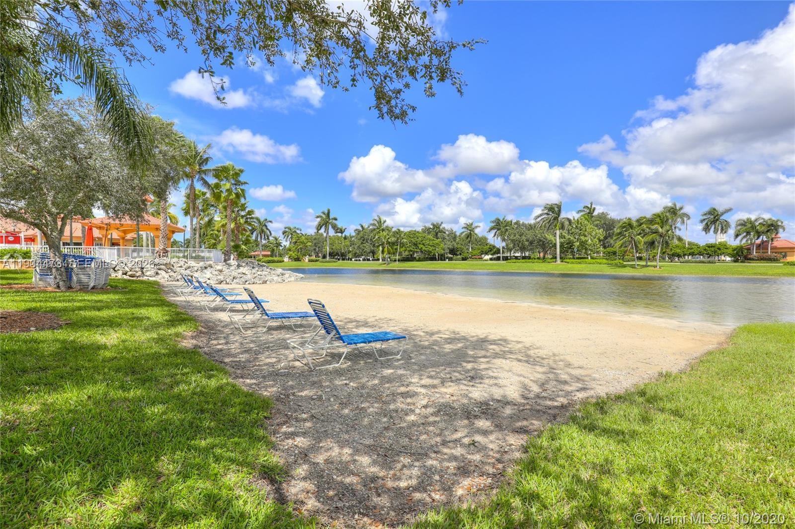 18900 Southwest 29th Street Miramar, FL 33029 - Photo 32 of 40 a view of a lake with houses in the back