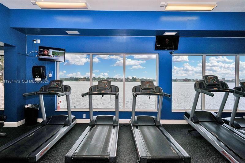 18900 Southwest 29th Street Miramar, FL 33029 - Photo 35 of 40 a room with gym equipment on the table and a large window