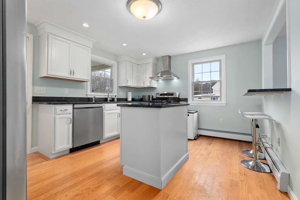 4 Brookside Court Methuen, MA 01844 - Photo 13 of 39 a kitchen with stainless steel appliances granite countertop a sink a stove a refrigerator cabinets and a window
