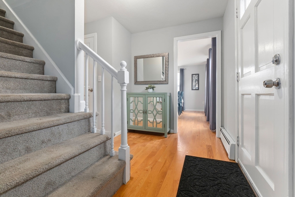 4 Brookside Court Methuen, MA 01844 - Photo 20 of 39 a view of a hallway with a couch and entryway