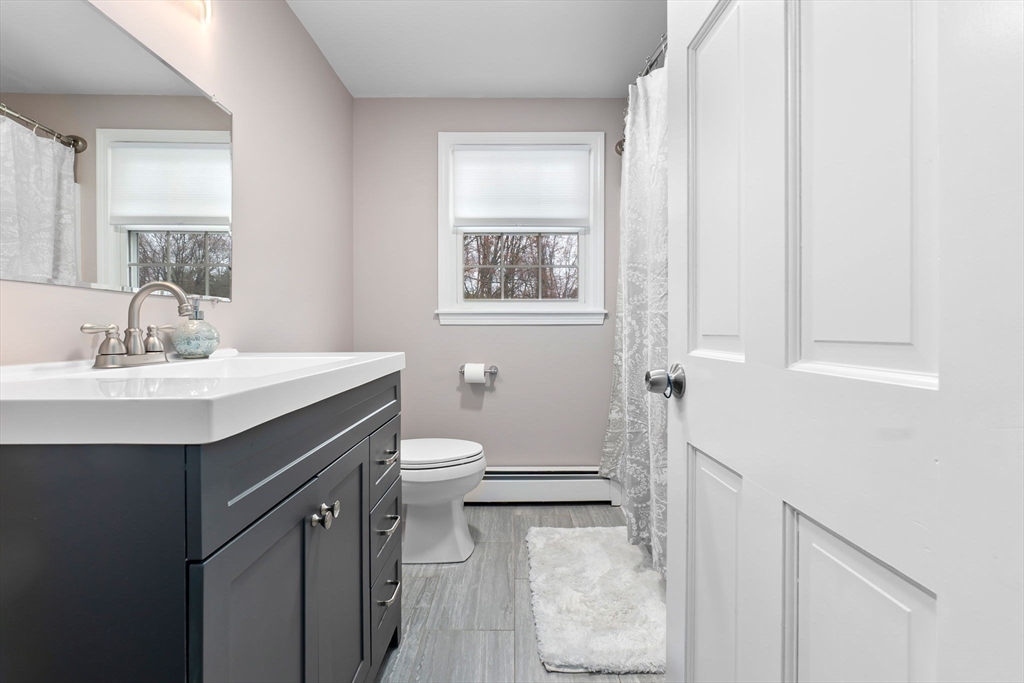 4 Brookside Court Methuen, MA 01844 - Photo 21 of 39 a bathroom with a sink a toilet and shower