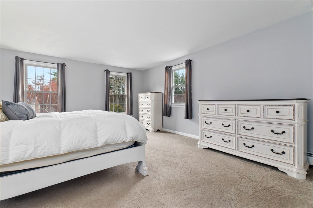4 Brookside Court Methuen, MA 01844 - Photo 23 of 39 a large bed sitting in a bedroom and dresser