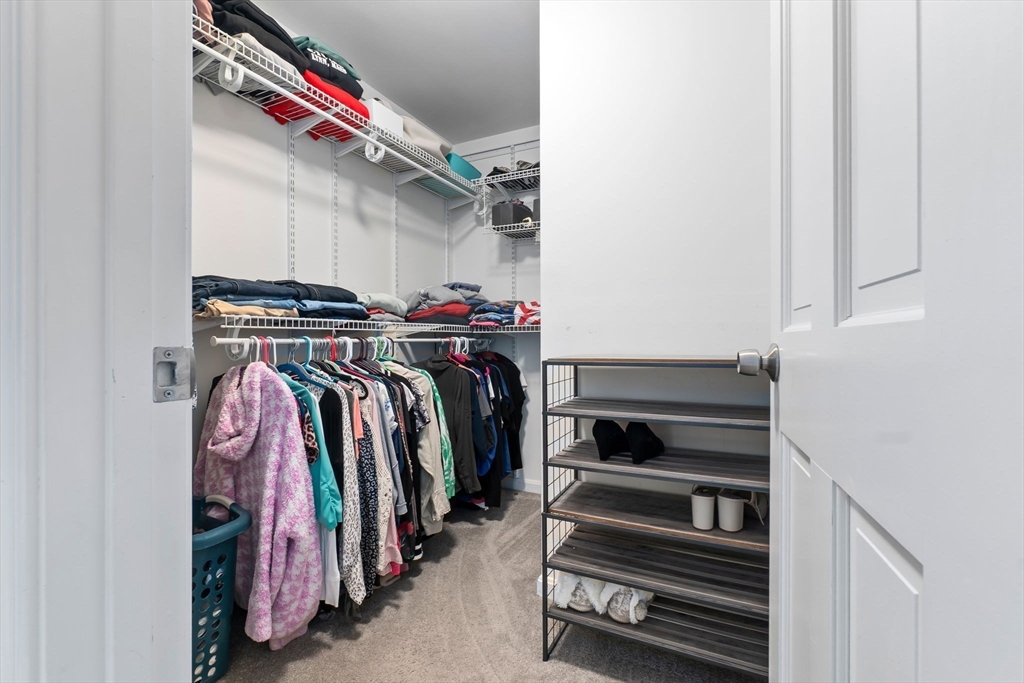 4 Brookside Court Methuen, MA 01844 - Photo 25 of 39 a view of walk in closet with clothes and shoes
