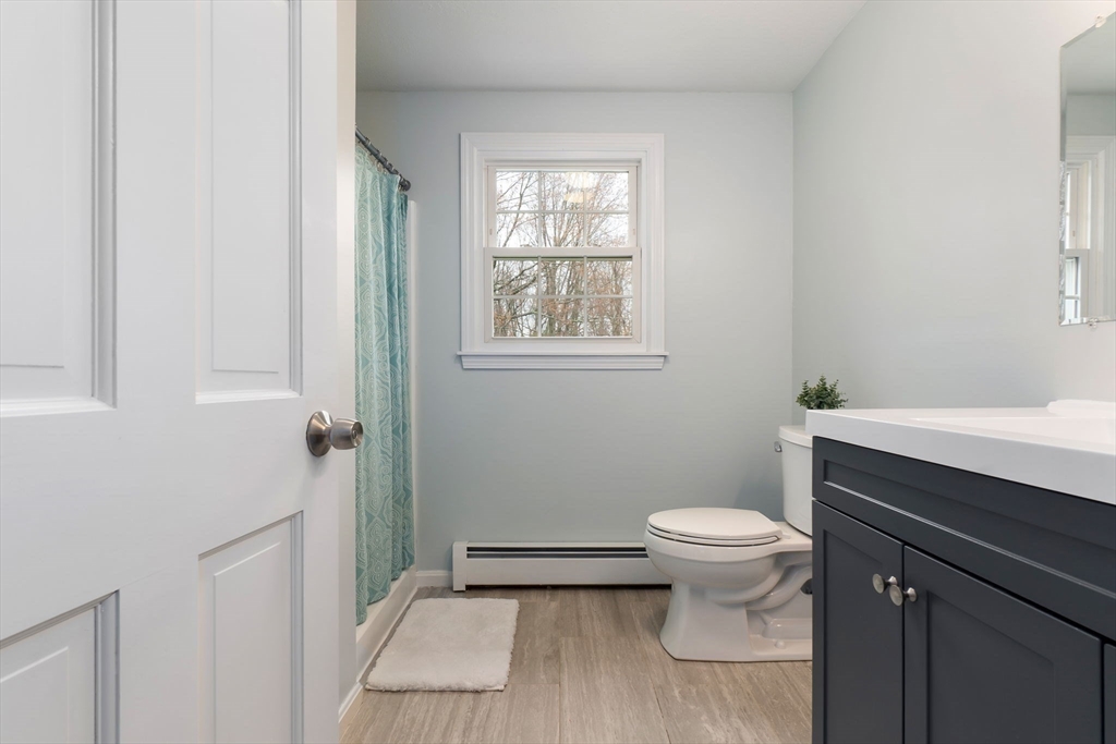 4 Brookside Court Methuen, MA 01844 - Photo 28 of 39 a bathroom with a toilet a sink and a window