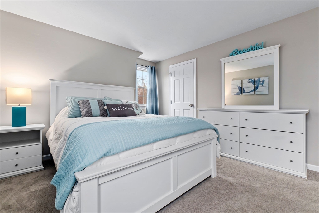 4 Brookside Court Methuen, MA 01844 - Photo 29 of 39 a bedroom with a bed and a dresser