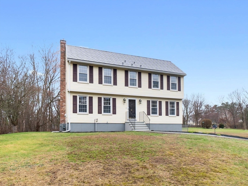 4 Brookside Court Methuen, MA 01844 - Photo 3 of 39 a front view of a house with garden