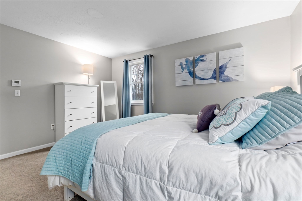 4 Brookside Court Methuen, MA 01844 - Photo 31 of 39 a bedroom with a bed and a painting on the wall