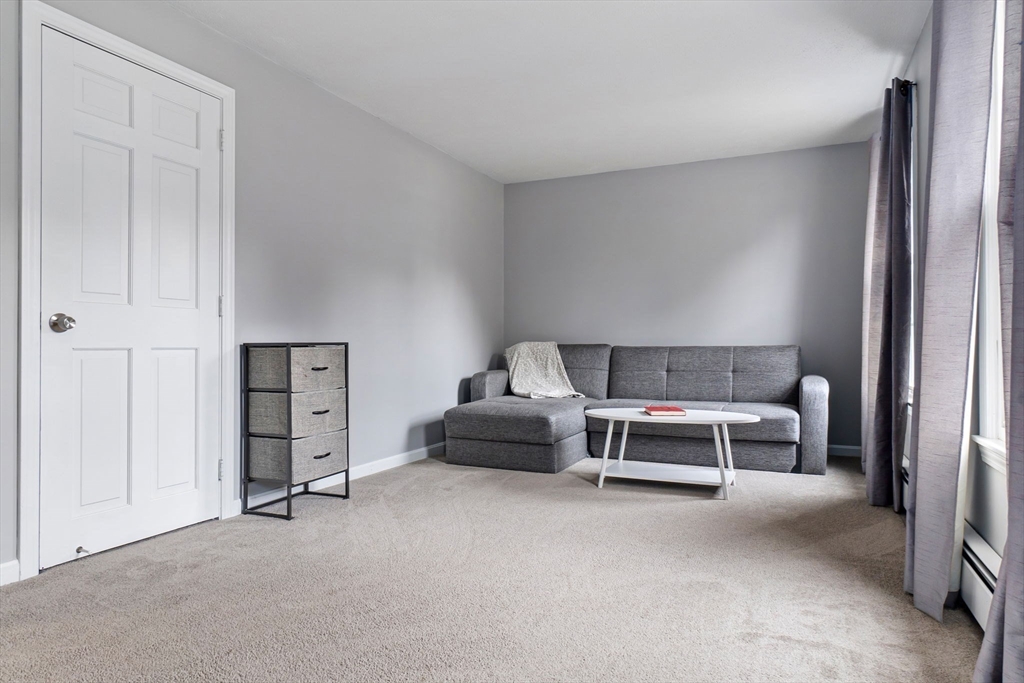 4 Brookside Court Methuen, MA 01844 - Photo 33 of 39 a bedroom with a bed and a table