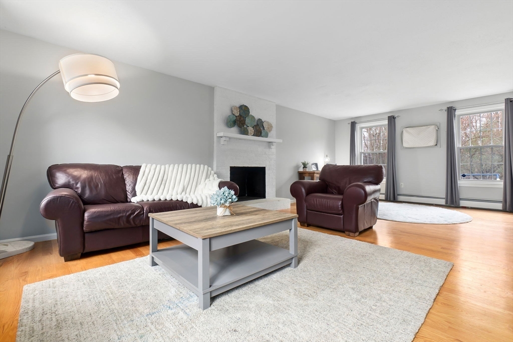 4 Brookside Court Methuen, MA 01844 - Photo 7 of 39 a living room with furniture and a fireplace