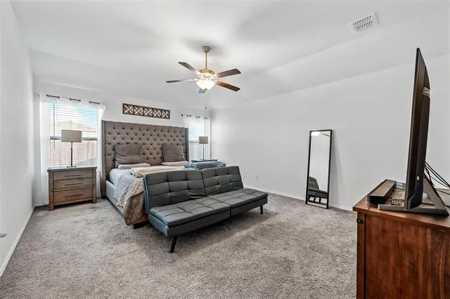 a kitchen with a sink a counter top space stainless steel appliances and cabinets