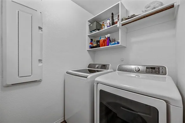 a bathroom with a shower sink vanity and mirror