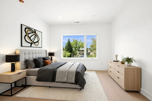 a bedroom with a bed and a couch