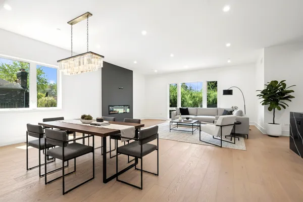 a living room with furniture a window and a table