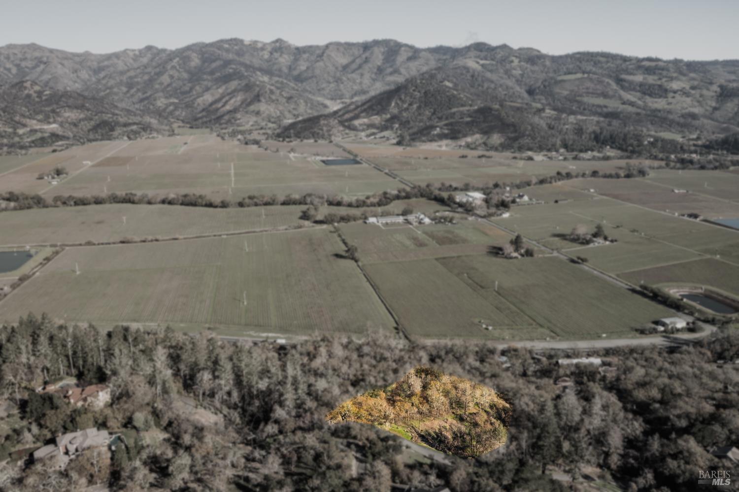 0 Tucker Road Calistoga, CA 94515 - Photo 14 of 14 a view of a dry field with mountains in the background