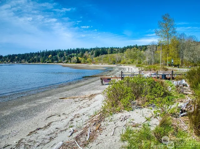 a view of a lake with a house in the background