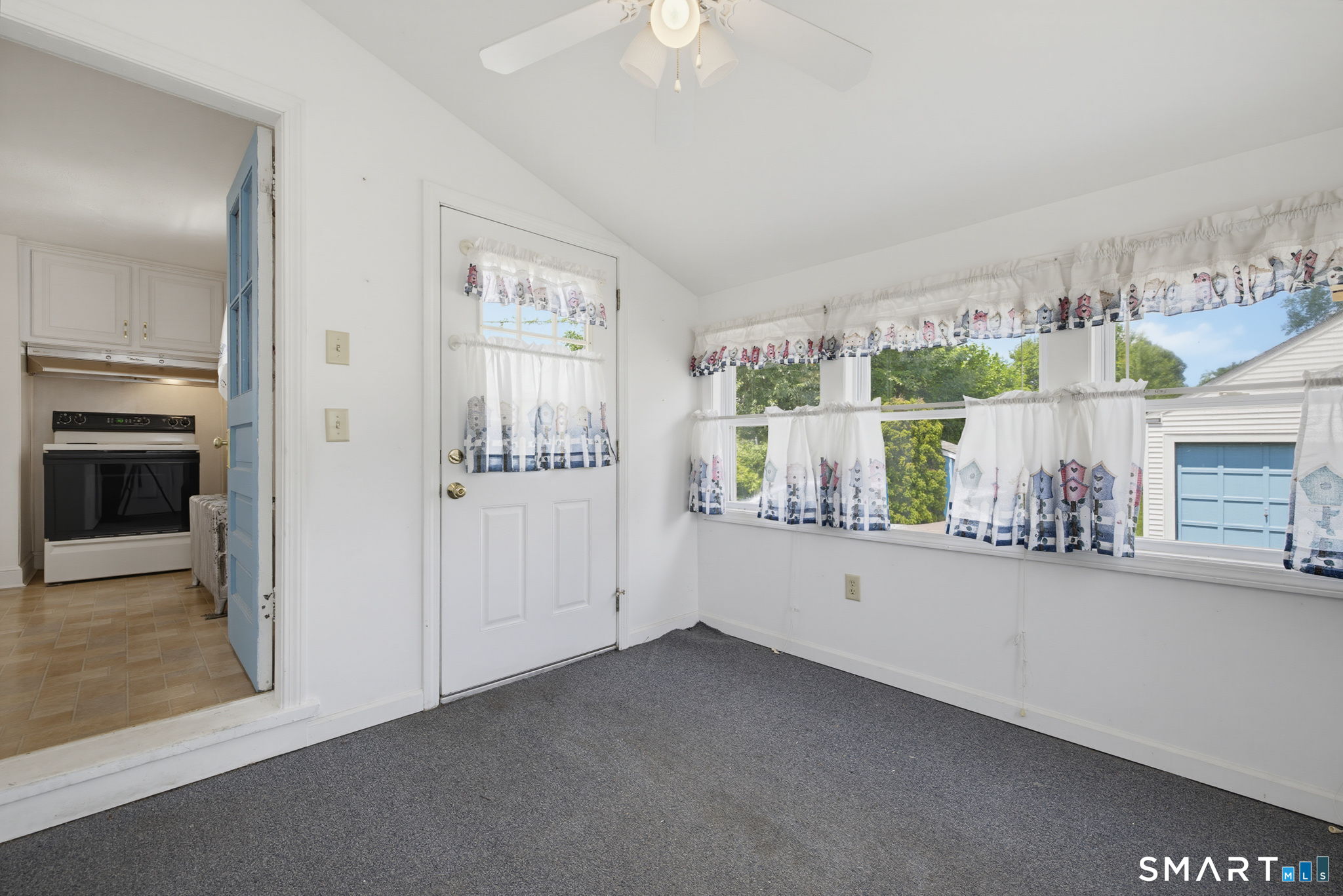 417 Hartford Road Manchester, CT 06040 - Photo 26 of 38 The enclosed porch leads to the kitchen. The door in this photo leads to the back yard.