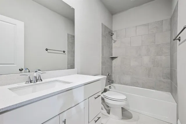 a bathroom with a sink a toilet and a bathtub