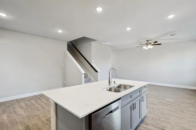 a kitchen with a sink vanity and chandelier