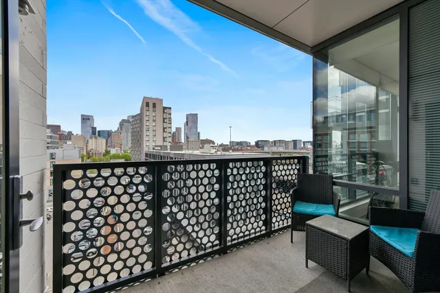 a view of a balcony with city view