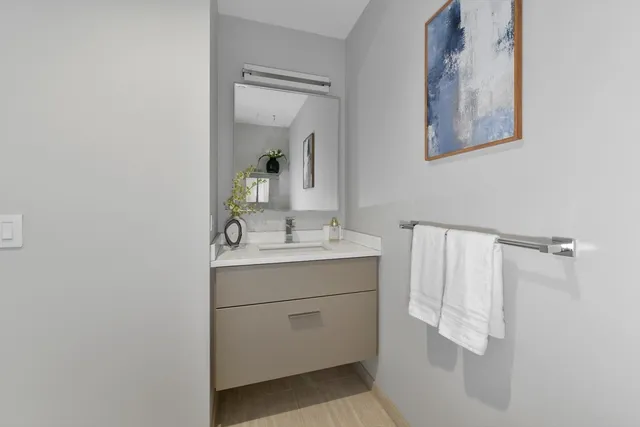 a bathroom with a sink and mirror