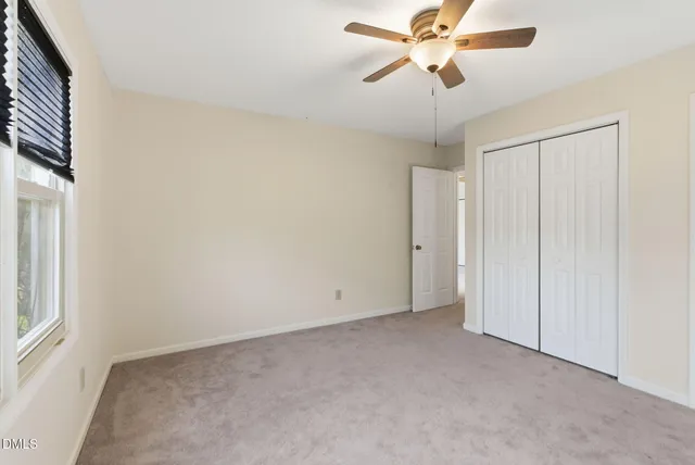 a view of a backyard with a wooden fence