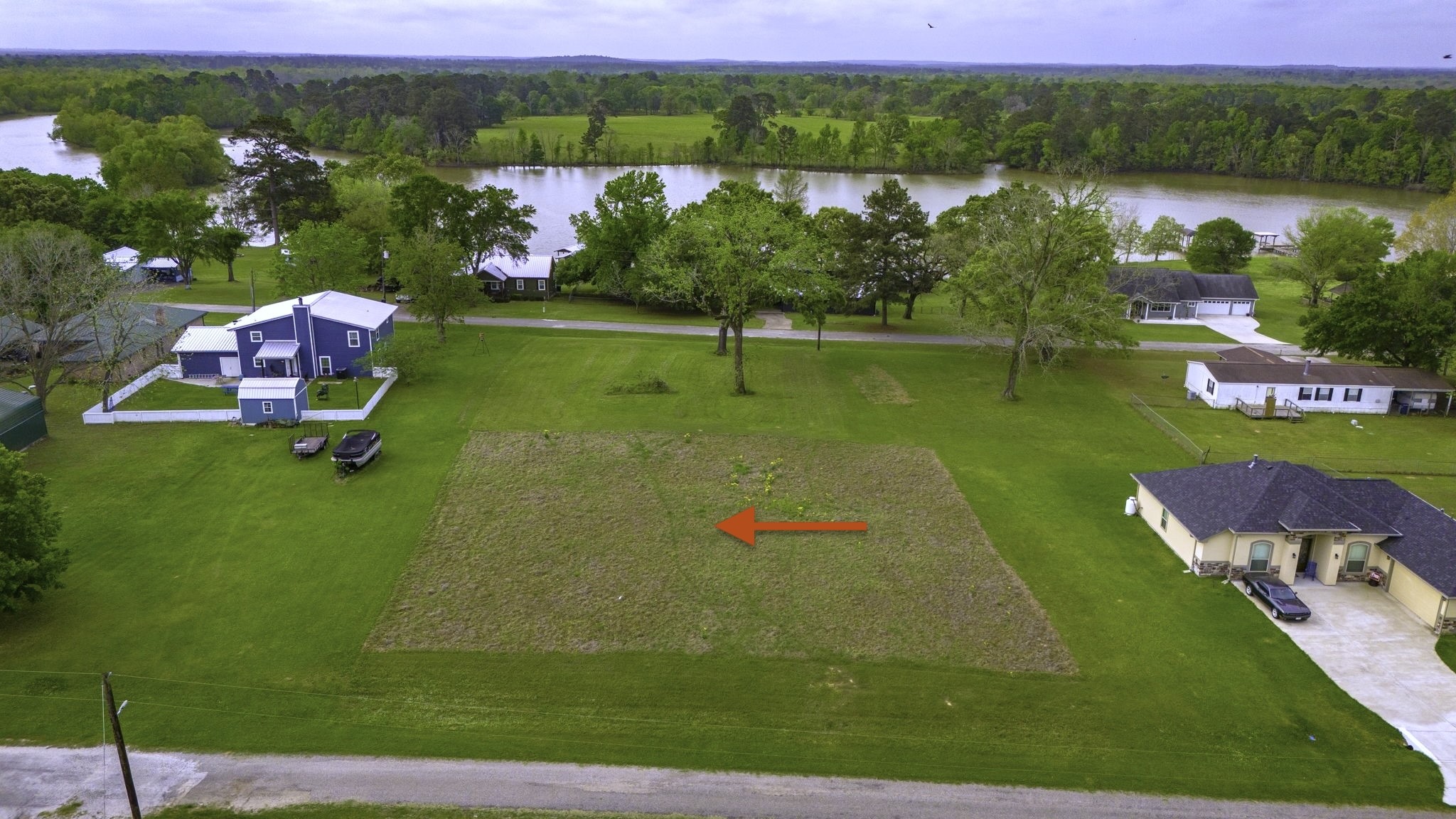 Tbd Liendo Drive Trinity, TX 75862 - Photo 3 of 13 an aerial view of a house with a yard and lake view