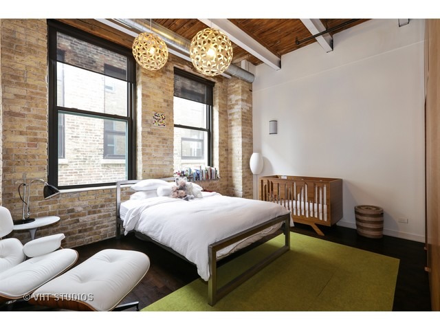 312 North May Street, Unit 5KL Chicago, IL 60607 - Photo 14 of 16 a bedroom with furniture and a large window