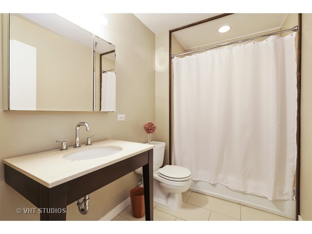 312 North May Street, Unit 5KL Chicago, IL 60607 - Photo 15 of 16 a bathroom with a sink and a mirror