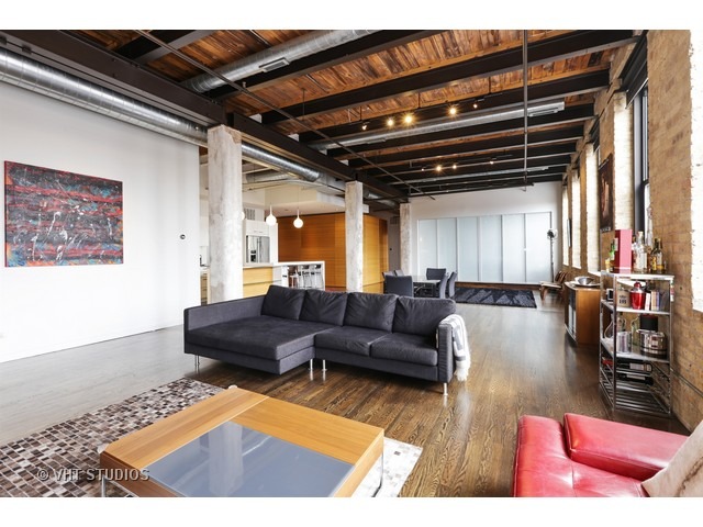 312 North May Street, Unit 5KL Chicago, IL 60607 - Photo 3 of 16 a living room with furniture and wooden floor